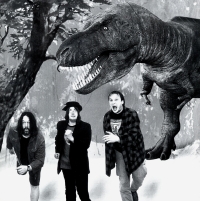 Hraboš as Rocker H. with his friends, music publicist -rdd- and Journalist J. fleeing from tyrannosaur in the picture for the book "Mimo Sud", April 2006, photo: Miroslav Lédl, graphic design by Kvaki