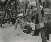 Cleaning a well at the Brontosaurus camp, 1975