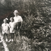 Sisters Květoslava and Adéla with their father in the forest, ca. 1944