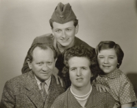 With his parents and sister in 1960, when he was at the military service