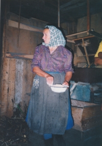 Helena Pelnářová preparing food for tourists, undated