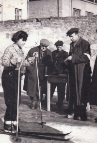 Rožnov ski jumping enthusiasts, the bent man is Mr. Jarolímek, who helped build the ski jumping hill at Hradisko. Early 1950s.		