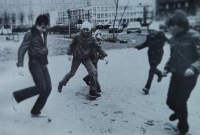 Playing tennis with boys in front of a Prague housing estate, late 1970s and early 1980s