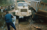 Dangerous crossing of a deep river at a collapsed bridge in Zaire