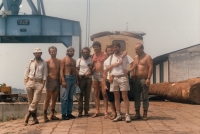 Loading cars onto a boat on the Ubangi River in central Africa