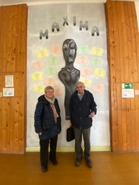 With former classmate Christa Petrásková inside the grammar school building