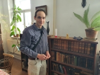 Milan Švrčina in front of his grandfather's library in his house in Chrudim