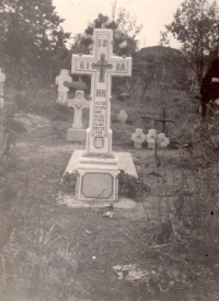 The grave of the late Alois Kovařík. Although the tombstone says the year of his death was 1955, the witness claims that her brother died in 1953 and the stone cross was not made by their father until three years after their son's death.