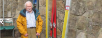 František Příhoda in 2020 in Thredbo in front of a collection of old skis