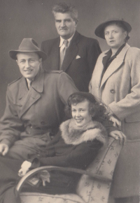 Sister of the witness (sitting in the chair) with her husband. Later, together with her son, they went to Canada, where the sister died.