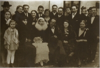 Father on the top left, in front of him is Ervín Adam, on the bottom left is sister Edita, mother on the right of her. Wedding of cousin Šáryka Slomovičová