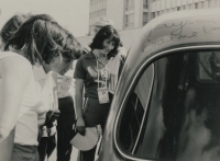 Alena Mejzlikova (by the car) in the Olympic Village in Moscow 1980. The car belonged to an Australian fan who collected athletes' signatures on it