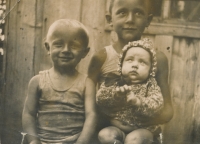 Three years old Michal Sevruk with older brother Leonid and sister Valentina