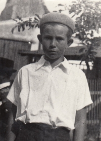 Jiří Cimrman as a little boy in the backyard around 1945