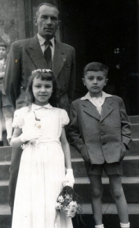 Jana Janštová at the First Communion (with her brother and father)