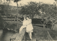 Mum Jarmila Němečková with her eldest son on the pond embankment