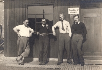 Witness's father Jaroslav Dopita Sr. (second from right) in front of his timber wholesale shop in Pardubice; driver Mr Rabas is second from left