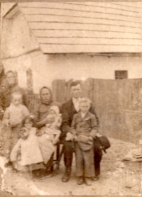 The Pražák family (Marie Balátová in white dress), Rovensko (Romania), early 1950s