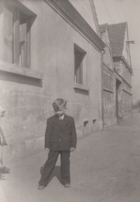 In front of grandparents' house in Dolánky nad Ohří, c. 1953