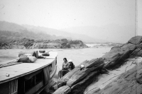 Ship ready to sail, rocks in a river in low water, Laos, 1984