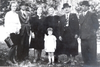 Bozena Šálová's family, from left: acquaintance, mother, grandmother, father, herdsman Mr. Dubovský, Božena Šálová four years old, ca. 1943