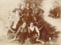 Mother Marie Brumková (first from right below in flowered dress), with her fellow milkmaids, Reflektor, late 1940s