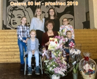 Witness (centre) with her family on her 80th birthday in 2019