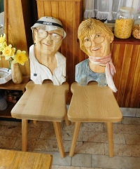 Carved chairs with portraits of Anna Paličkové and her husband František Palička