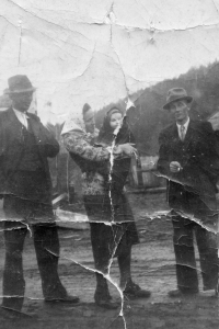 Antoniea Tichopádová's mother Anežka Šihorová is in the middle with daughter Eva, the mother's brother Antonín Tkačík is standing at left, and neighbour Valoš Graca is on the right; Přerovec, circa 1946