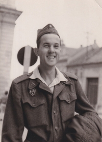 Brother Jiří carrying his civilian coat from the dry cleaners, 1961