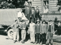 Construction workers by a truck in Opava, likely in 1955. Antonie Tichopádová's father Bohumil Šihora is standing bottom centre, wearing the lightest clothes