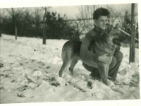 Jiří Hübner in his childhood with a dog