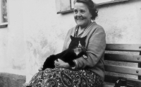 Mum with cat in front of house number 88 in Bílé Potok