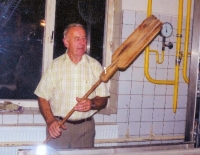 Arnošt Obrusník with a baker's shovel in the bakery in Dolní Benešov when another oven was added in 1999