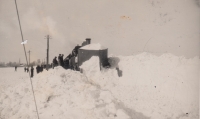 Father Miloslav Macek at work. Snow-covered Ramzová and manual snow shovelling