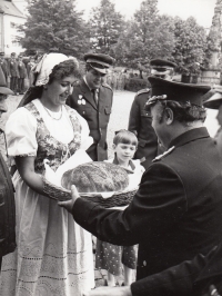 Witness in traditional Žlutice costume during a visit of firemen from the GDR, 1985