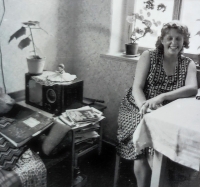 The wife of the witness next to the radio that the witness's dad built