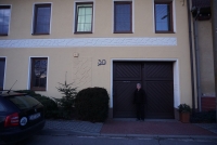 Jan Chloupek in front of his house