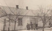 The Bartoš family in front of their house in Horodiště in Volhynia, right to left: mother Evženie Lišinková, née Bartošová, grandmother Anna Bartošová, grandfather Antonín Bartoš and son Jaroslav Bartoš