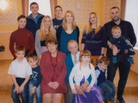 Mr. and Mrs. Matějka with their grandchildren, around 2020