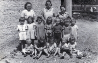 In the kindergarten yard in Pitárné, Osoblaha region. Alexandra Šmiřáková is top left