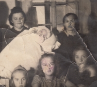 The christening of Zdeňka Řeháková. On the right her mother, on the left her godmother Běta Lodová, below her sisters