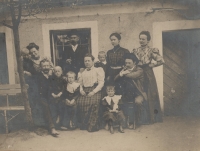 Grandmother Dokupilová (far left) and grandfather Dokupil below her, each holding one child, the witness's father and his brother the twins