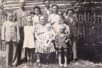 Leopoldina Čermáková's parents with their children after their arrival from Yugoslavia to Heřmanice, 1945