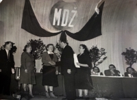 Marie Prchalová accepts the award at the International Women's Day celebrations