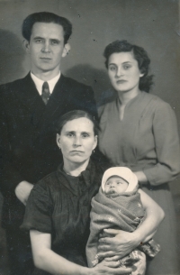 Father, mother and Zinaida Kozan (born Sova) with Sasha Kozlov in her arms, village Nedrigailov, Sumy region, 1961