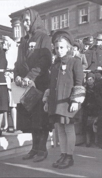 Nine years old Libuška receives an award for her father, autumn 1945