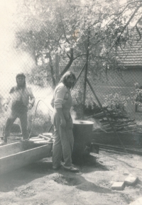 Ivan Nekuda (behind) with his brother Miroslav during a pig killing event, Mělník-Chloumek, ca. 1980