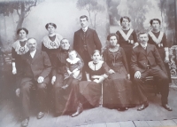 The family of Žofie Horová, the mother of the witness: from the left, seated Vincenc Hora, grandfather, Pavlína Horová, née Zívalová, grandmother, Vašek, son of the eldest aunt, aunt Anna, eldest aunt Marie, married name Krejčí, František Krejčí, her husband. Standing from left: aunts Milenka and Vera, only uncle Alexander, Zofia, mother of the witness, aunt Naďa, Volhynia, 1914