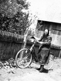 Mother Gertruda Matušková with a bicycle, dressed in " a farmers´costume"